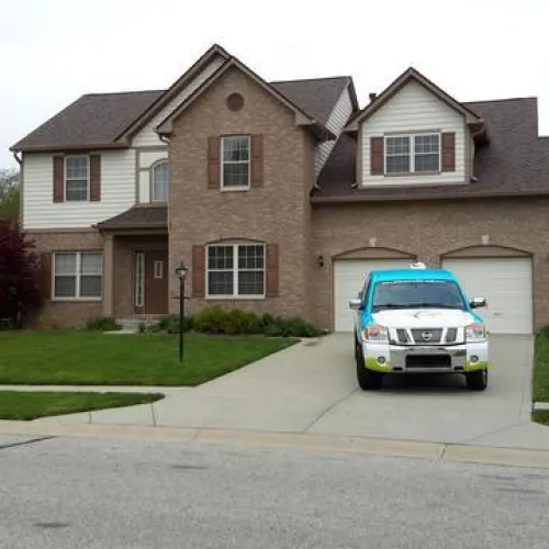 a car parked in front of a house