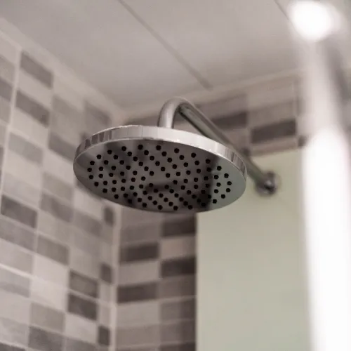 a shower head in a bathroom