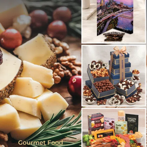 Close-up of gourmet cheese, nuts, and fresh herbs alongside assorted gourmet gift boxes with chocolates and charcuterie