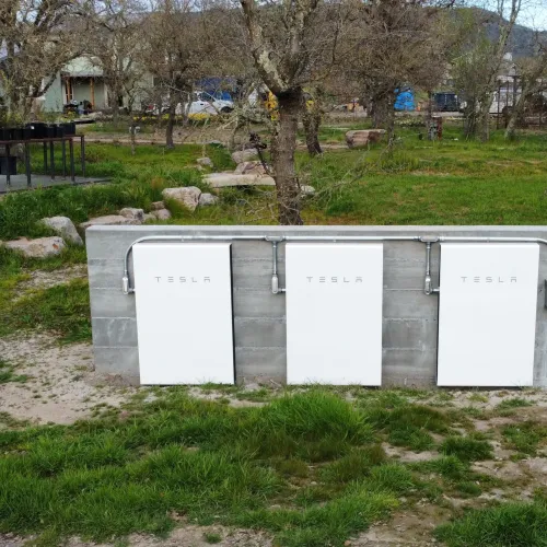a group of white rectangular objects in a grassy area
