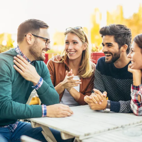a group of people sitting at a table