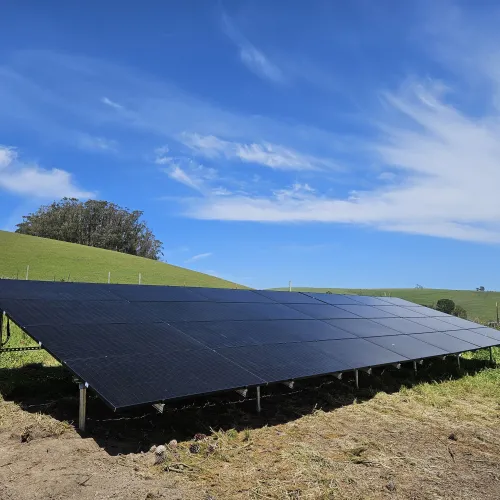 a solar panel on a hill