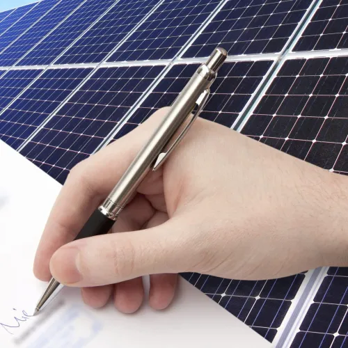 a person holding a pen