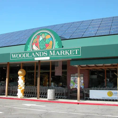 a store front with a green roof