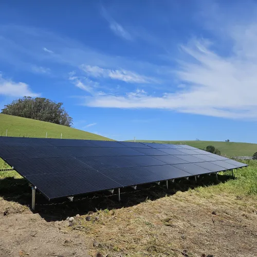 a solar panel on a hill