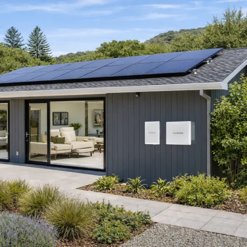 Modern home with solar panels on roof and enphase battery energy storage in marin county
