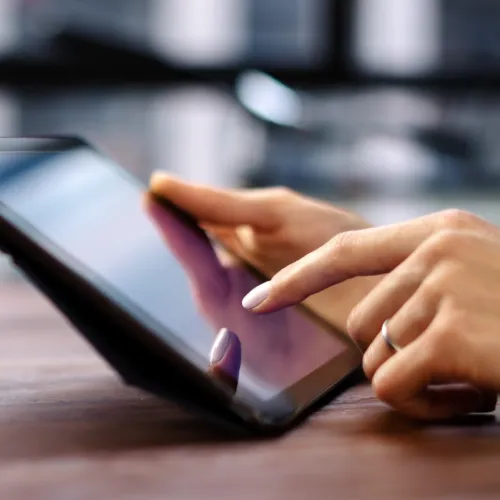 a person holding a tablet