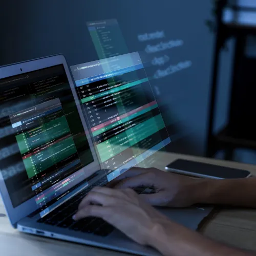 a person typing on a laptop