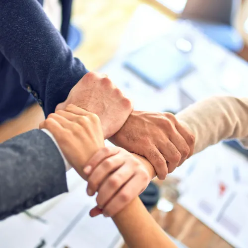 close-up of people shaking hands