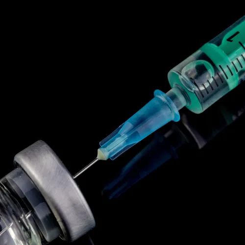 a close-up of a syringe and a tube