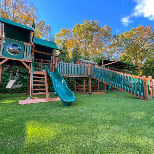 backyard playground with artificial turf