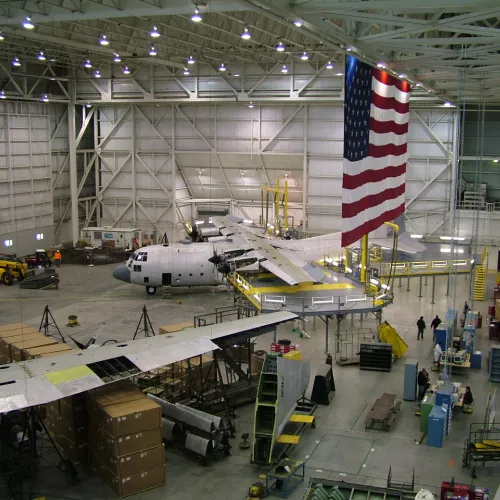a large airplane hangar with several planes