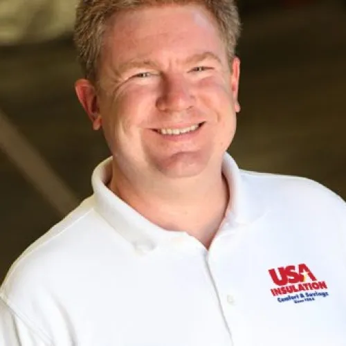 a man smiling for the camera