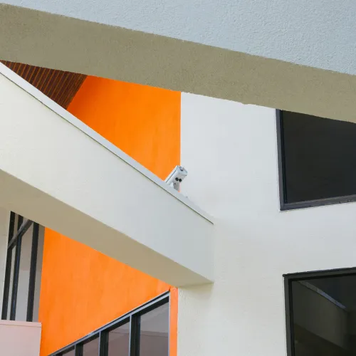 a white wall with a blue and orange design