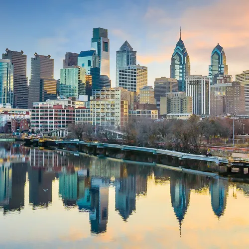 a city skyline with a river