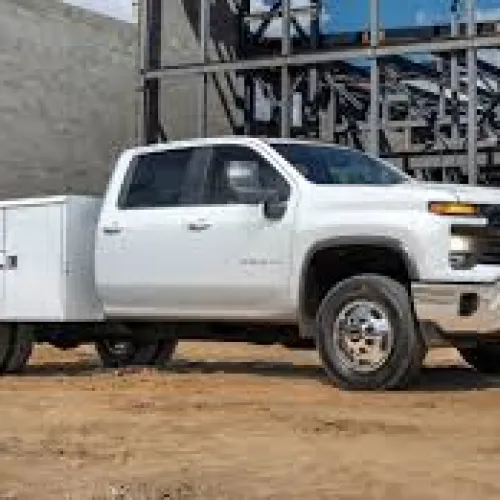 Close-up view of a modern construction vehicle cabin with clear glass windows and exterior lights