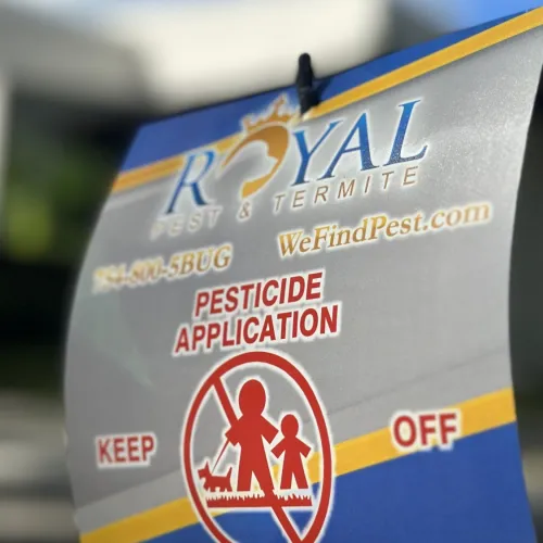 Royal Pest & Termite sign warning of pesticide application with no entry for people and pets.