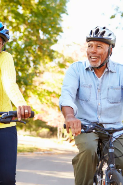 a man and a woman riding bikes