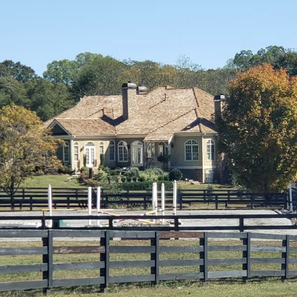 a house with a fence in front of it