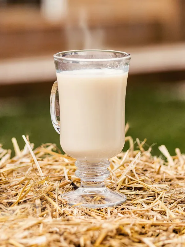 a close up of a beverage in a glass cup on a table