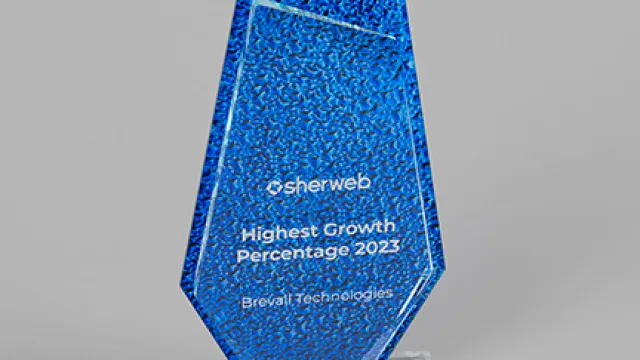 Blue geometric award trophy recognizing Brevi Technologies for highest growth percentage in 2023.