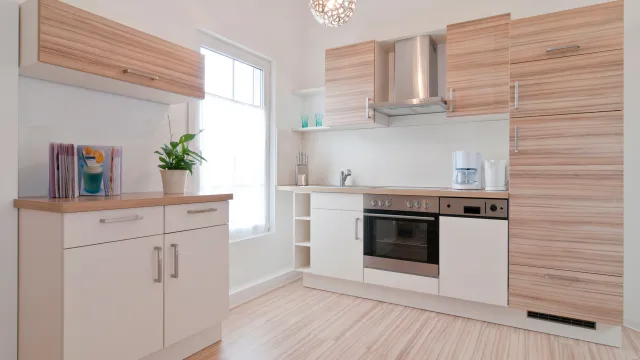 a kitchen with white cabinets