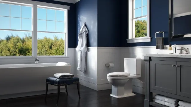a bathroom with a tub toilet and sink