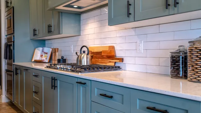 a kitchen with white cabinets