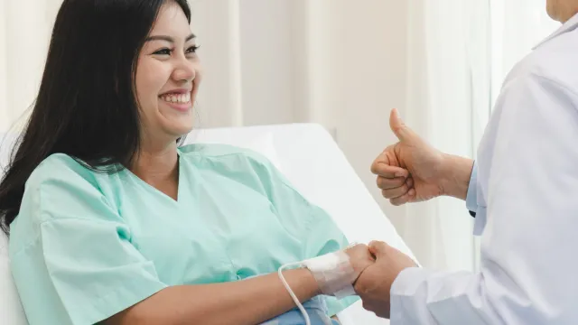 a doctor giving a patient a shot