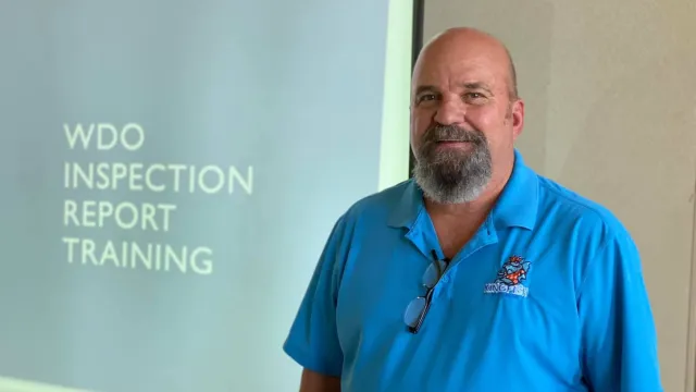 a man in a blue shirt