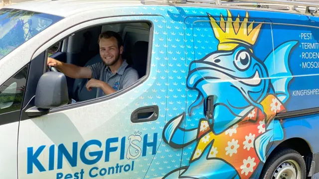 man smiling in a van