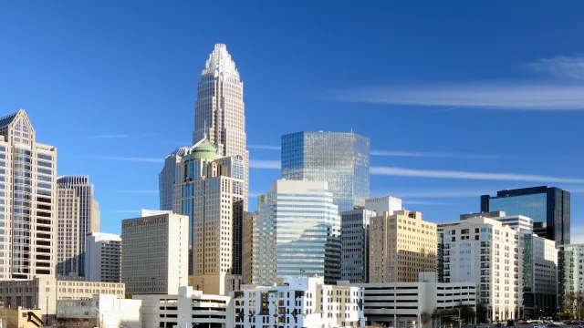 a city skyline with tall buildings