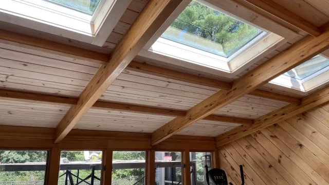 a wooden ceiling with windows