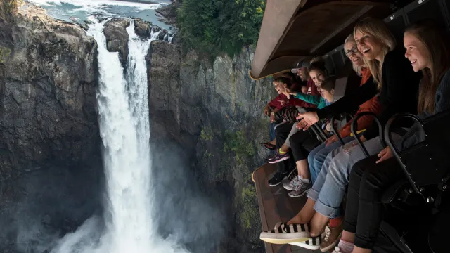 a group of people standing on top of a mountain