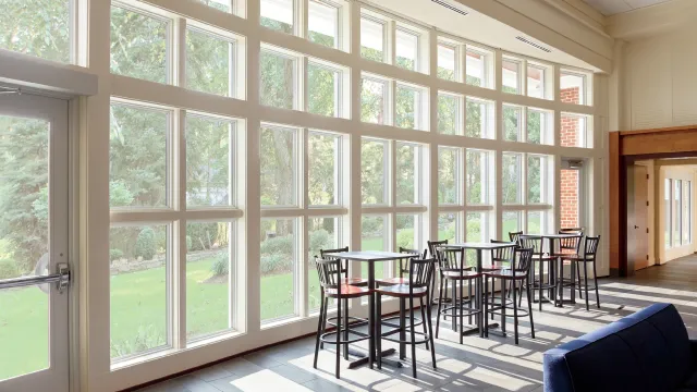 a room with a table chairs and a couch