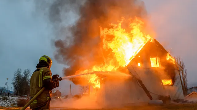 a firefighter putting out a fire