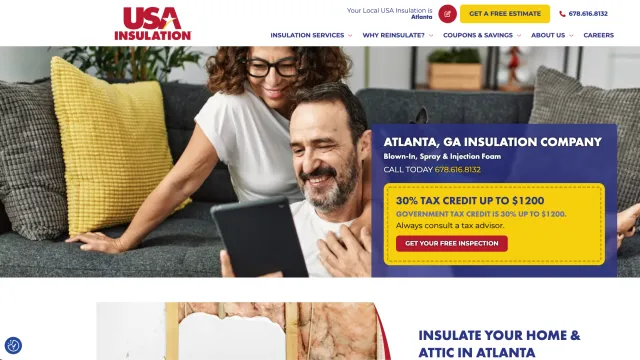 Smiling couple relaxing on couch looking at tablet, promoting Atlanta insulation services with tax credit offer.
