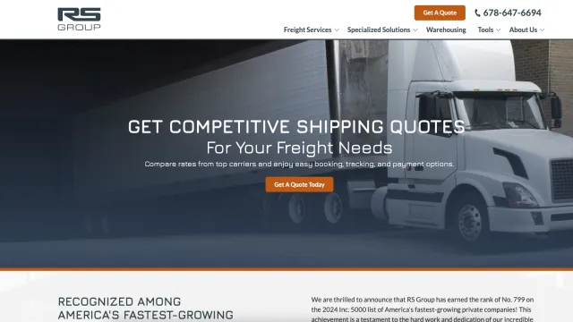 White freight truck parked outside warehouse with promotional text for competitive shipping quotes