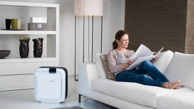 Woman relaxing on white couch reading a magazine beside a modern air purifier in a stylish living room.