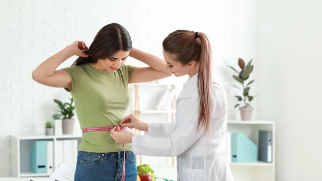 a person holding a girl's hair