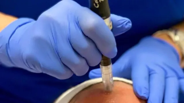 a person holding a syringe