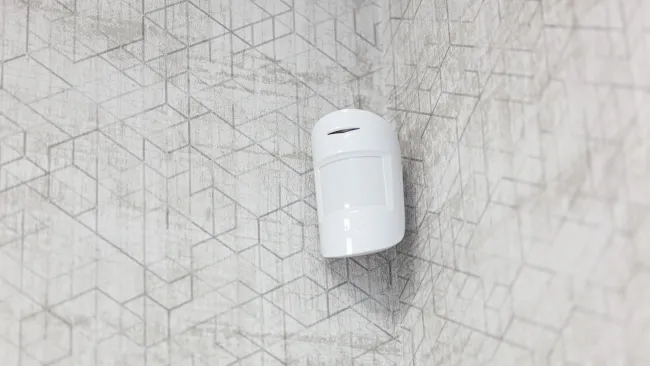 a white device on a white tiled surface