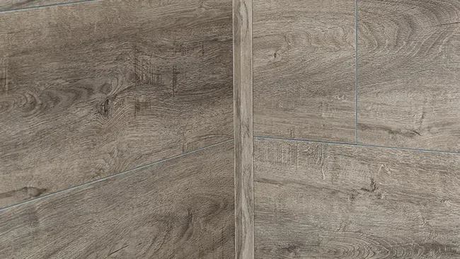 Close-up of wood-textured wall tiles with natural brown tones and detailed grain patterns in corner arrangement