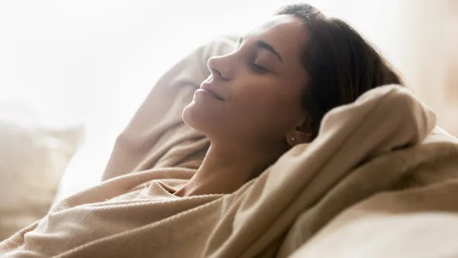 a person sleeping on a bed