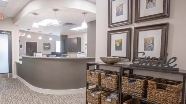 a large kitchen with a counter and baskets