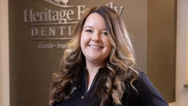 a woman smiling for the camera