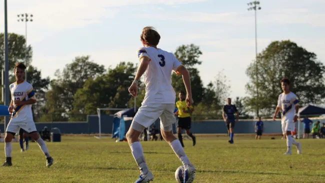 a group of men playing football