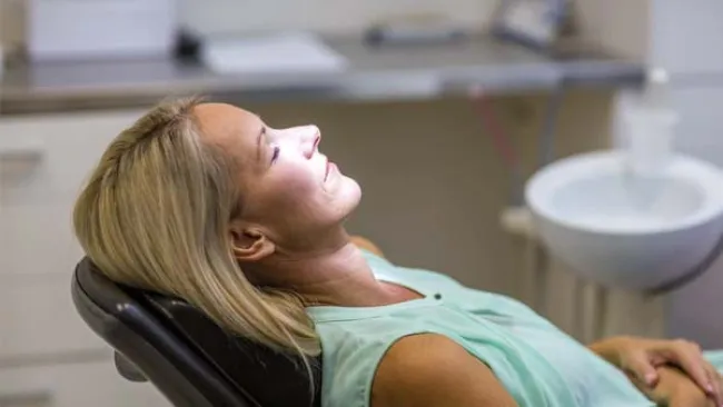 a woman sleeping on a chair