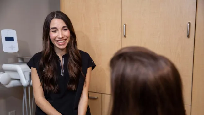 a woman standing in a room