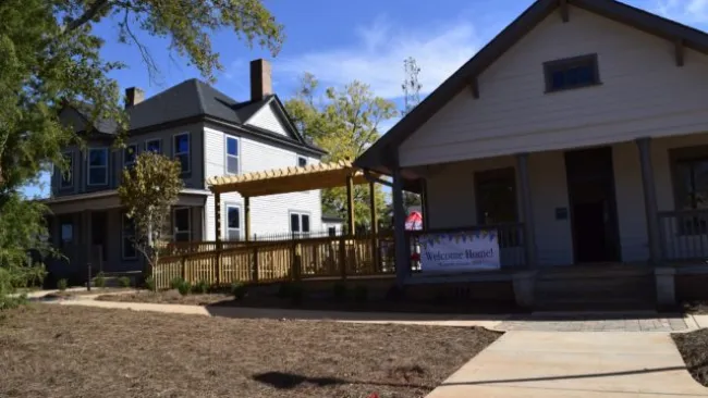 a house with a sign in front